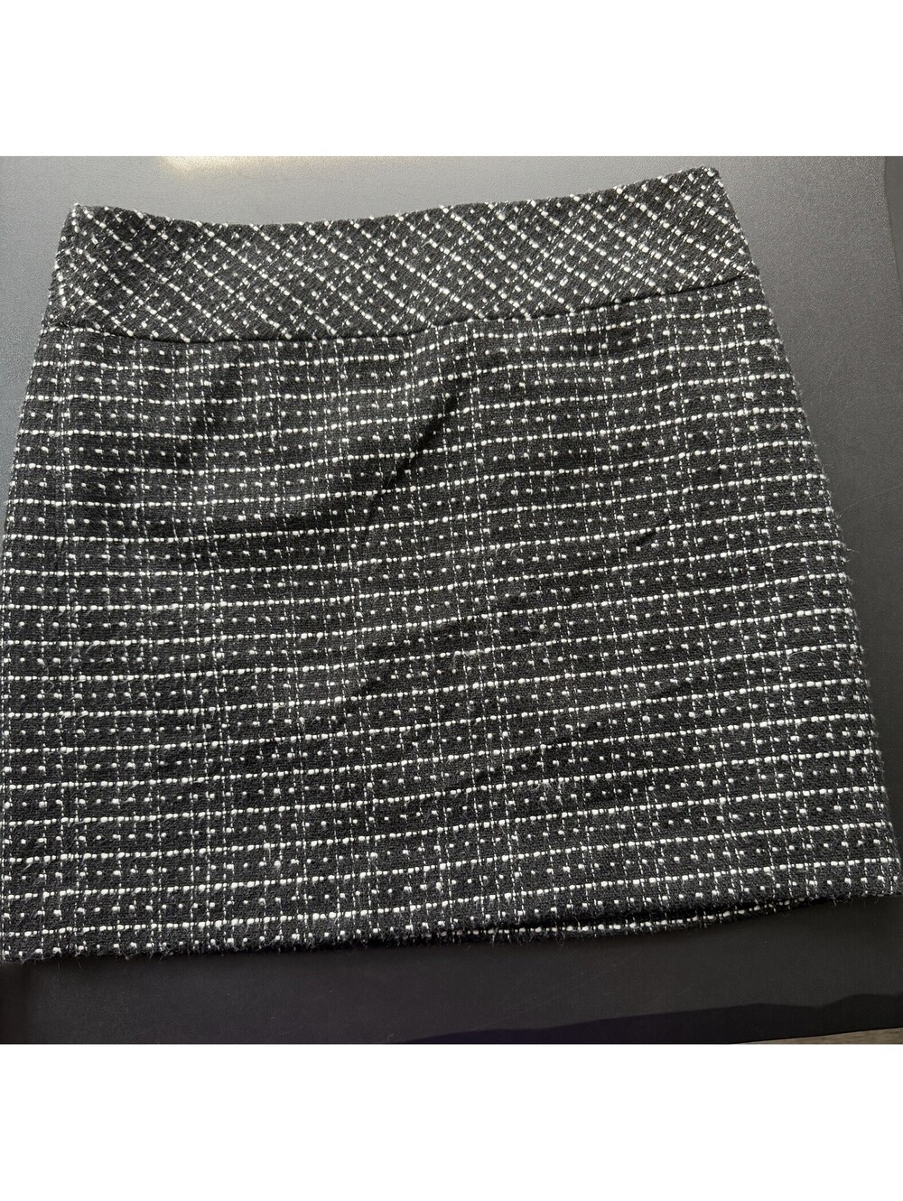 LOFT Shimmer Tweed Mini Skirt features a black and white plaid pattern